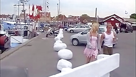Blonde serves her boyfriends cock with a public blowjob