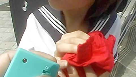 Barely legal Asian in school uniform sucking inside a restroom
